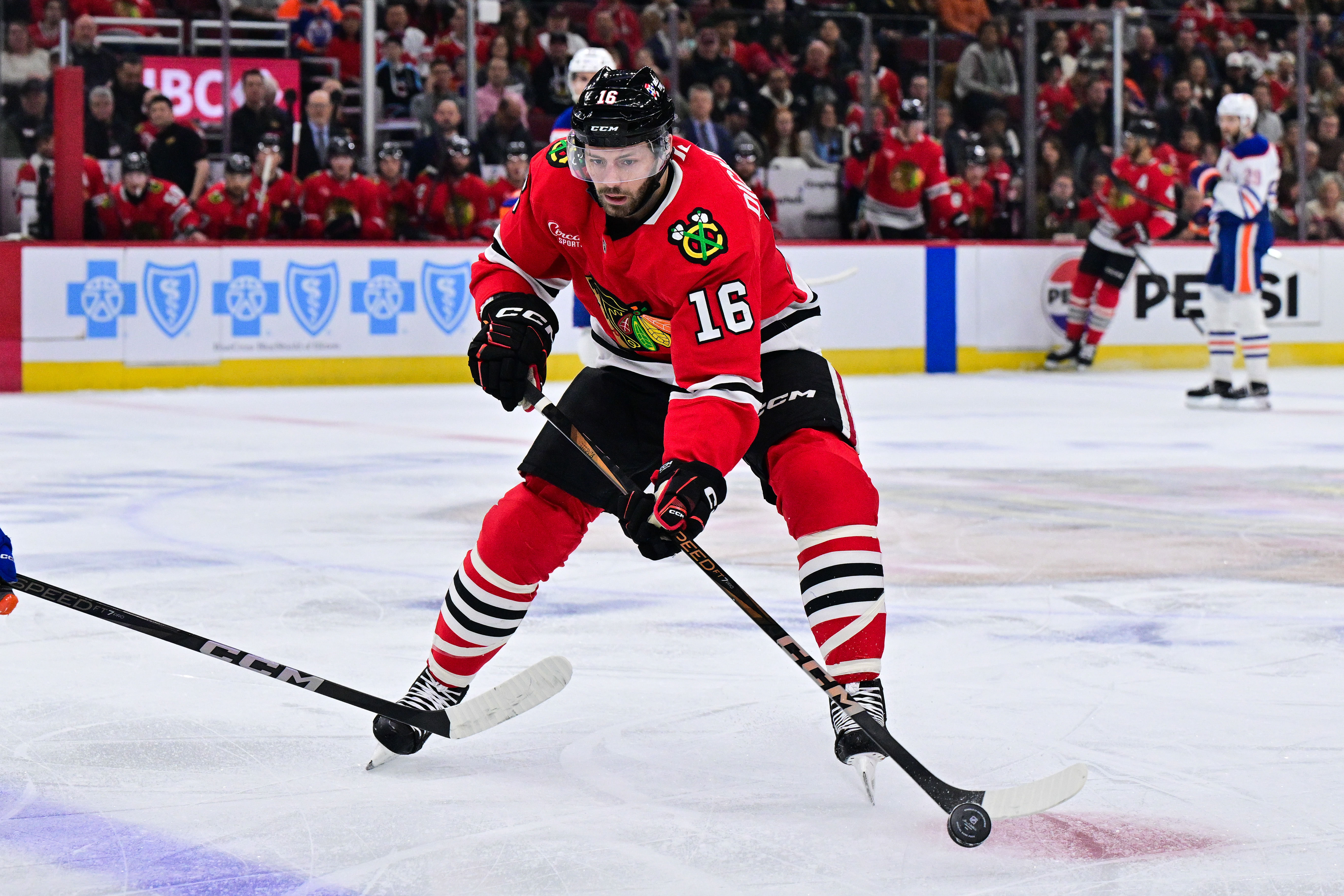 Jason Dickinson could be a casualty as the Hawks look to free up cap space to sign Connor Bedard - Source: Imagn